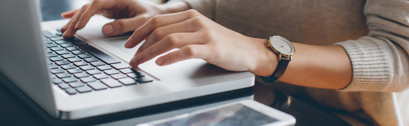 Woman typing on keyboard